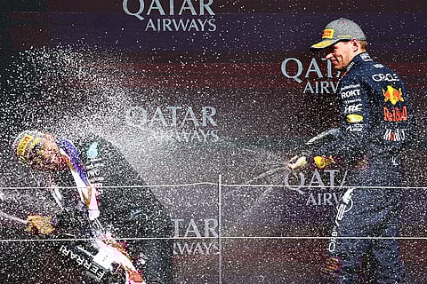 Second placed Max Verstappen celebrates with Race winner Lewis Hamilton